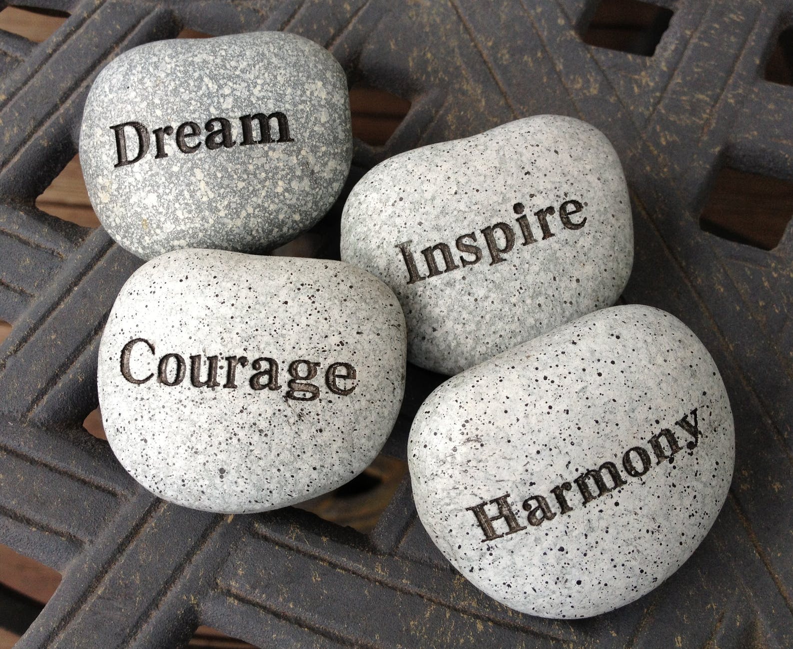cobblestones saying dream, courage, inspire, harmony. - Community